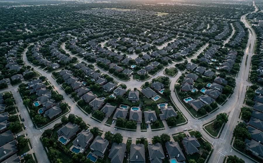 Aerial view of a suburban neighborhood of closely spaced houses